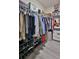 A large walk-in closet with organized shelving, hanging racks, and ample storage space at 114 Sunset Point Dr, Ormond Beach, FL 32174