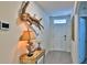 Inviting entryway with stylish decor, tile flooring and a white front door at 114 Sunset Point Dr, Ormond Beach, FL 32174
