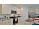 Modern kitchen featuring granite countertops, stainless steel appliances, and white cabinetry at 114 Sunset Point Dr, Ormond Beach, FL 32174