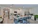 Spacious kitchen with a granite-topped island, stainless steel appliances, and white cabinetry at 114 Sunset Point Dr, Ormond Beach, FL 32174