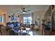 Inviting living room with stylish decor, comfortable seating and a ceiling fan at 114 Sunset Point Dr, Ormond Beach, FL 32174
