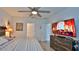 Spacious main bedroom featuring a ceiling fan, and ensuite bathroom at 114 Sunset Point Dr, Ormond Beach, FL 32174