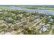 Aerial view of a residential neighborhood near a beautiful waterfront, showcasing community charm at 118 Orange Ave, Edgewater, FL 32132