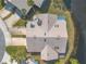 A bird's eye view of a home with a neutral colored roof showing landscaping and proximity to the water at 128 Black Crow Cir # 4070, Daytona Beach, FL 32119