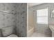 Bathroom featuring decorative wallpaper and white tiled floor and tub at 128 Black Crow Cir # 4070, Daytona Beach, FL 32119