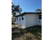 The backyard has a recently painted home with a mix of shady and sunny areas, and a well-maintained yard at 128 Orange Ave, Edgewater, FL 32132