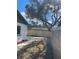 Backyard with a new wooden fence, recently mulched garden, and extended driveway area, ready for customization at 128 Orange Ave, Edgewater, FL 32132