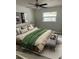 Comfortable bedroom featuring modern decor, window, and stylish furnishings at 128 Orange Ave, Edgewater, FL 32132