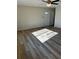 Open living room area with attractive wood-look flooring and a bright front door, creating a welcoming space at 128 Orange Ave, Edgewater, FL 32132