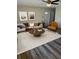 Bright living room with neutral tones, stylish decor, and hardwood floors at 128 Orange Ave, Edgewater, FL 32132