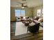 Spacious living room with ample seating, bright natural light, and stylish decor at 128 Orange Ave, Edgewater, FL 32132