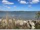 Waterfront view with rocky shore at 128 Orange Ave, Edgewater, FL 32132