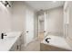 Modern bathroom showcasing a soaking tub, double vanity, and neutral color palette at 13 Arena Blanca, Ponce Inlet, FL 32127