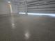 Spacious two car garage with epoxy floors and an automatic door opener at 13 Arena Blanca, Ponce Inlet, FL 32127
