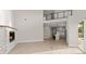 Spacious living area features a fireplace, hardwood floors, and ample natural lighting at 13 Arena Blanca, Ponce Inlet, FL 32127