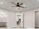 Open floor plan showcasing ceiling fan, recessed lighting, and kitchen view at 13 Arena Blanca, Ponce Inlet, FL 32127