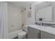 Bathroom with a modern vanity, toilet, and tiled shower-tub combination, all in a clean and bright setting at 150 Wax Myrtle Woods Ct # 7B, Deltona, FL 32725