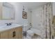 Bathroom with a modern vanity, toilet, and tiled shower-tub combination, all in a clean and bright setting at 150 Wax Myrtle Woods Ct # 7B, Deltona, FL 32725