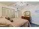 Bedroom features a closet and a comfortable bed, with a dresser and mirror at 150 Wax Myrtle Woods Ct # 7B, Deltona, FL 32725