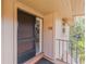 Front door entrance to condo showcasing front patio and unit number at 150 Wax Myrtle Woods Ct # 7B, Deltona, FL 32725