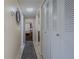 Hallway with a neutral color palette and closet space at 150 Wax Myrtle Woods Ct # 7B, Deltona, FL 32725