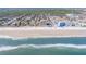 Picturesque aerial view of condo buildings situated along a beautiful beach at 1705 S Atlantic Ave # 201, New Smyrna Beach, FL 32169