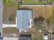 Aerial view of a charming single-story home, showcasing its well-maintained roof and neat yard at 1935 Fern Palm Dr, Edgewater, FL 32141