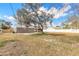 Large backyard featuring a concrete patio and privacy fencing at 1935 Fern Palm Dr, Edgewater, FL 32141
