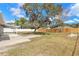 Expansive backyard featuring mature trees and a large, open layout at 1935 Fern Palm Dr, Edgewater, FL 32141