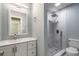 Bathroom featuring a modern vanity and a shower with tile surround at 1935 Fern Palm Dr, Edgewater, FL 32141