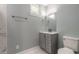 Bathroom featuring a vanity, mirror, towel rack and toilet at 1935 Fern Palm Dr, Edgewater, FL 32141