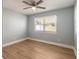 Bedroom featuring wood floors, fresh paint, and a large window at 1935 Fern Palm Dr, Edgewater, FL 32141