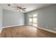 Light-filled bedroom with a ceiling fan and sliding glass doors leading to the backyard at 1935 Fern Palm Dr, Edgewater, FL 32141