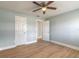 Bedroom featuring wood floors, fresh paint, and a modern ceiling fan at 1935 Fern Palm Dr, Edgewater, FL 32141