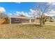 Charming single-story home showcasing a well-maintained lawn, newer fence, and inviting curb appeal at 1935 Fern Palm Dr, Edgewater, FL 32141