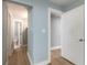Hallway view of interior doors, leading to bathrooms and closets at 1935 Fern Palm Dr, Edgewater, FL 32141