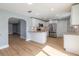 Modern kitchen featuring stainless appliances, stone countertops, new cabinets, and an open layout at 1935 Fern Palm Dr, Edgewater, FL 32141