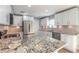 Modern kitchen featuring stainless appliances, stone countertops, new cabinets, and an island at 1935 Fern Palm Dr, Edgewater, FL 32141