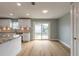 Modern kitchen featuring stainless appliances, stone countertops, new cabinets, and an open layout at 1935 Fern Palm Dr, Edgewater, FL 32141