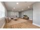 Bright living room with neutral walls, wood floors, a comfortable couch, and decoratively curated accents at 1935 Fern Palm Dr, Edgewater, FL 32141