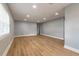 Bright living room featuring new flooring, fresh paint, recessed lighting, and ample natural light at 1935 Fern Palm Dr, Edgewater, FL 32141