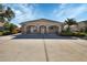 This is the community center, featuring a covered entrance and well-manicured landscaping at 1997 Turnbull Lakes Dr, New Smyrna Beach, FL 32168