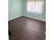 Bright bedroom with hardwood floors and large windows, perfect for relaxing at 2231 Orange Tree Dr, Edgewater, FL 32141