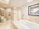 Elegant bathroom featuring a frameless glass shower and jacuzzi style tub at 231 Riverside Dr # 1509-1, Holly Hill, FL 32117