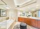 Luxurious bathroom featuring double sinks and a jacuzzi style tub at 231 Riverside Dr # 1509-1, Holly Hill, FL 32117