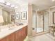 Elegant bathroom featuring a glass-enclosed shower, neutral tones, and a stylish vanity at 231 Riverside Dr # 1509-1, Holly Hill, FL 32117
