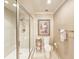 Bright bathroom with a modern shower, decorative artwork, and a classic toilet at 231 Riverside Dr # 1509-1, Holly Hill, FL 32117