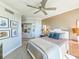 Bedroom featuring an upholstered headboard and waterfront view at 231 Riverside Dr # 1509-1, Holly Hill, FL 32117