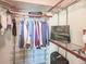 Walk-in closet with metal racks and shelves for organized storage at 231 Riverside Dr # 1509-1, Holly Hill, FL 32117