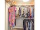 Walk-in closet with metal racks and shelves for organized storage at 231 Riverside Dr # 1509-1, Holly Hill, FL 32117